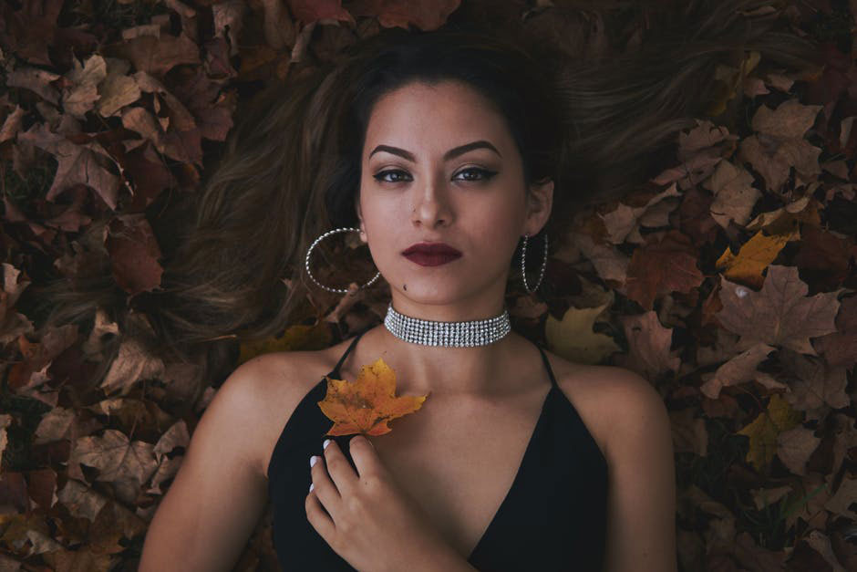 girl wearing diamond hoop earrings in leaves