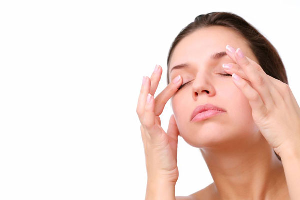 girl massaging her eyelids