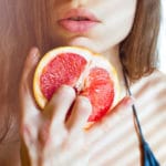 Beautiful Young Sexy Woman Bikini Holding Grapefruit Stock Photo