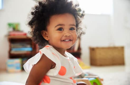 Happy Baby Girl Playing Toys Playroom Stock Photo