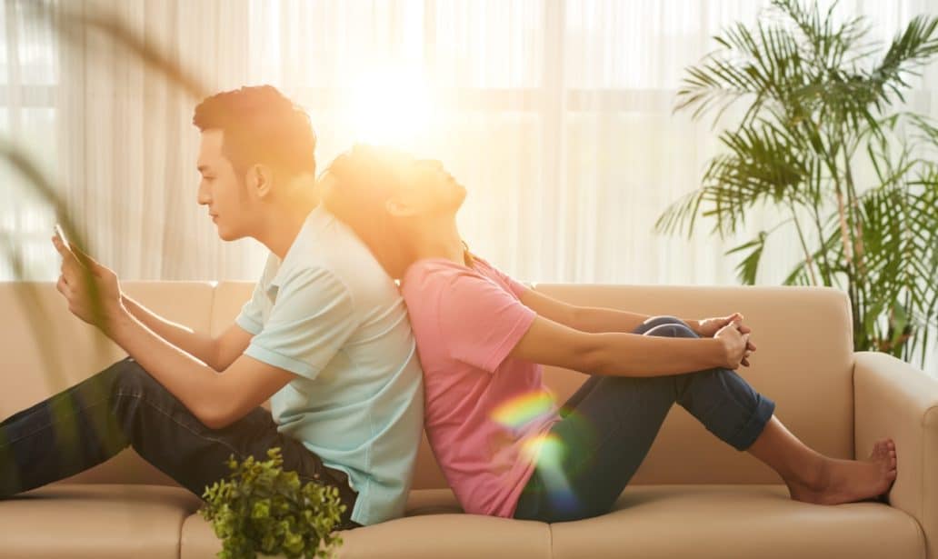 Vietnamese Young Couple Doing Nothing Home