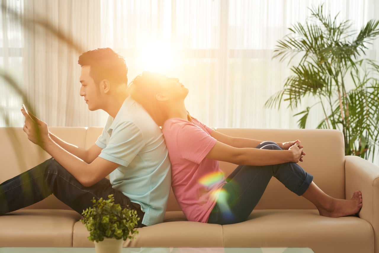 Vietnamese Young Couple Doing Nothing Home