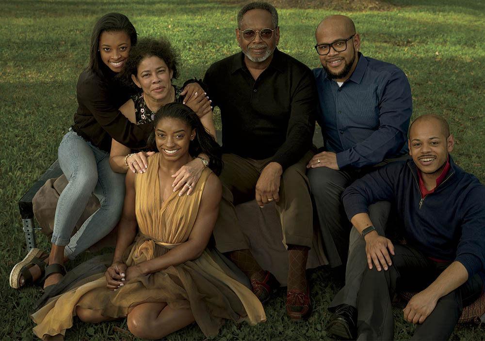 Biles (seated, wearing an Alaïa dress), photographed in February 2020 with her family in Spring, Texas.