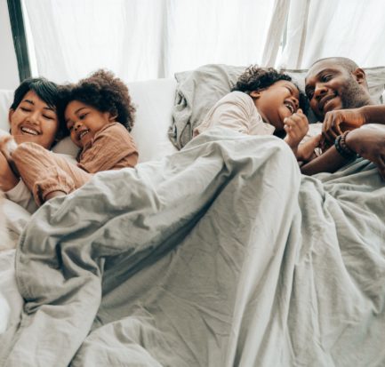 happy family in bed