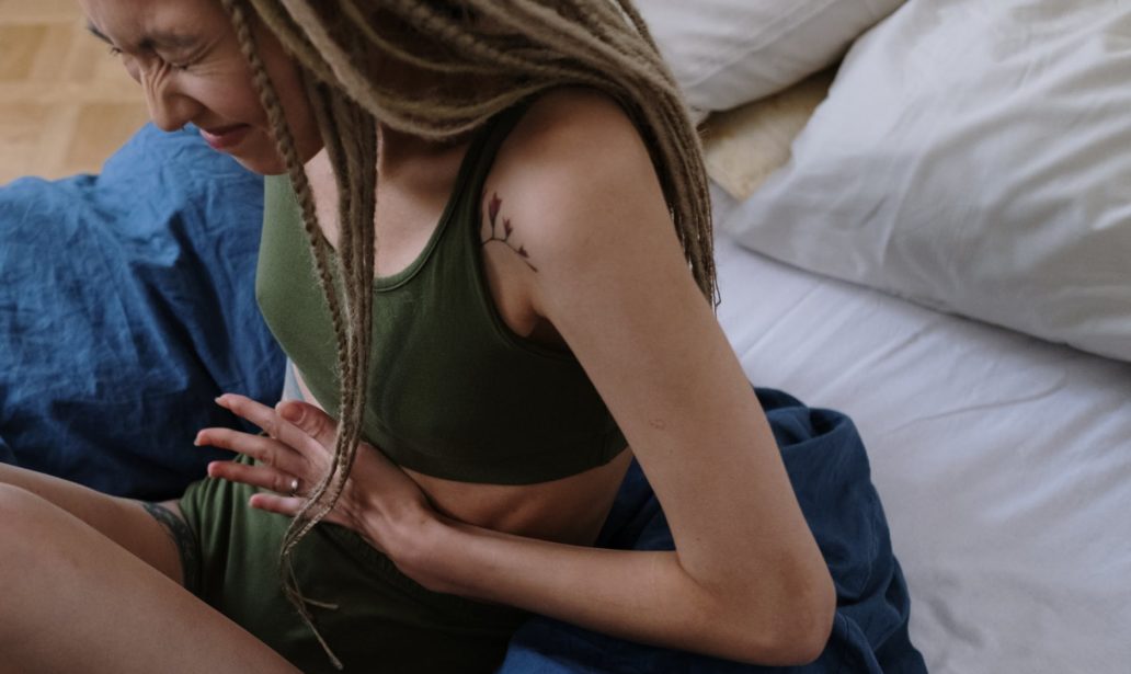 woman suffering from a stomach pain