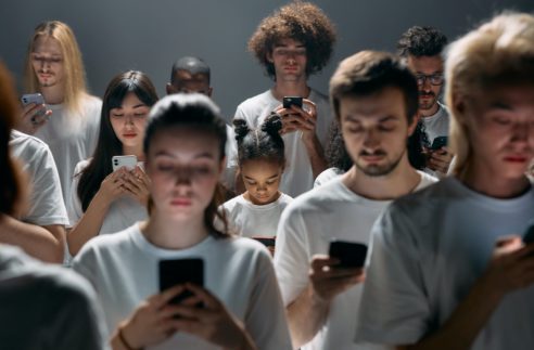photo of people engaged on their phones