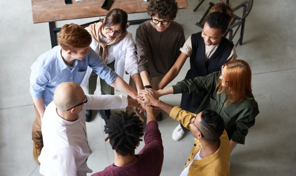 photo of people holding each other's hands