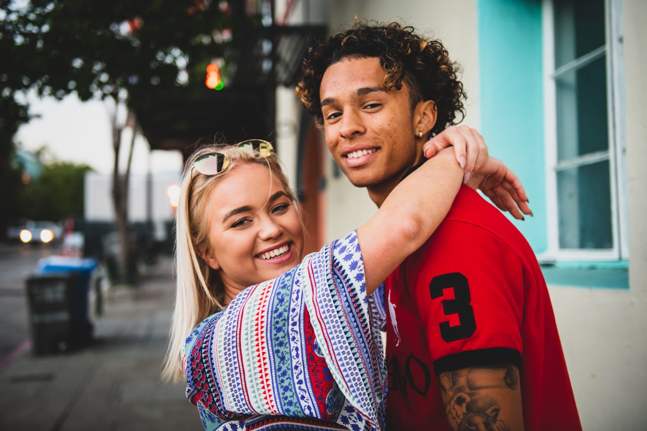 close up photo fo woman hugging a guy