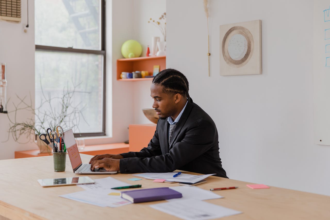man using his laptop in the office